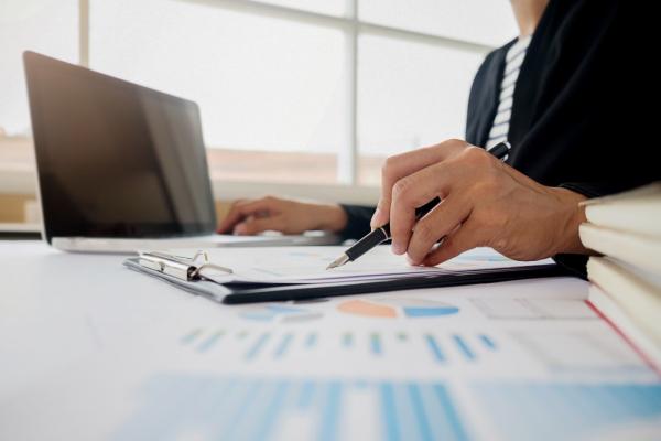 business-adviser-analyzing-financial-figures-denoting-the-progress-internal-revenue-service-checking_t20_LOBXAo