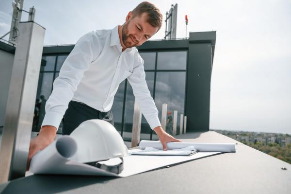 manager of construction site project is reading th 2022 11 04 16 07 19 utc